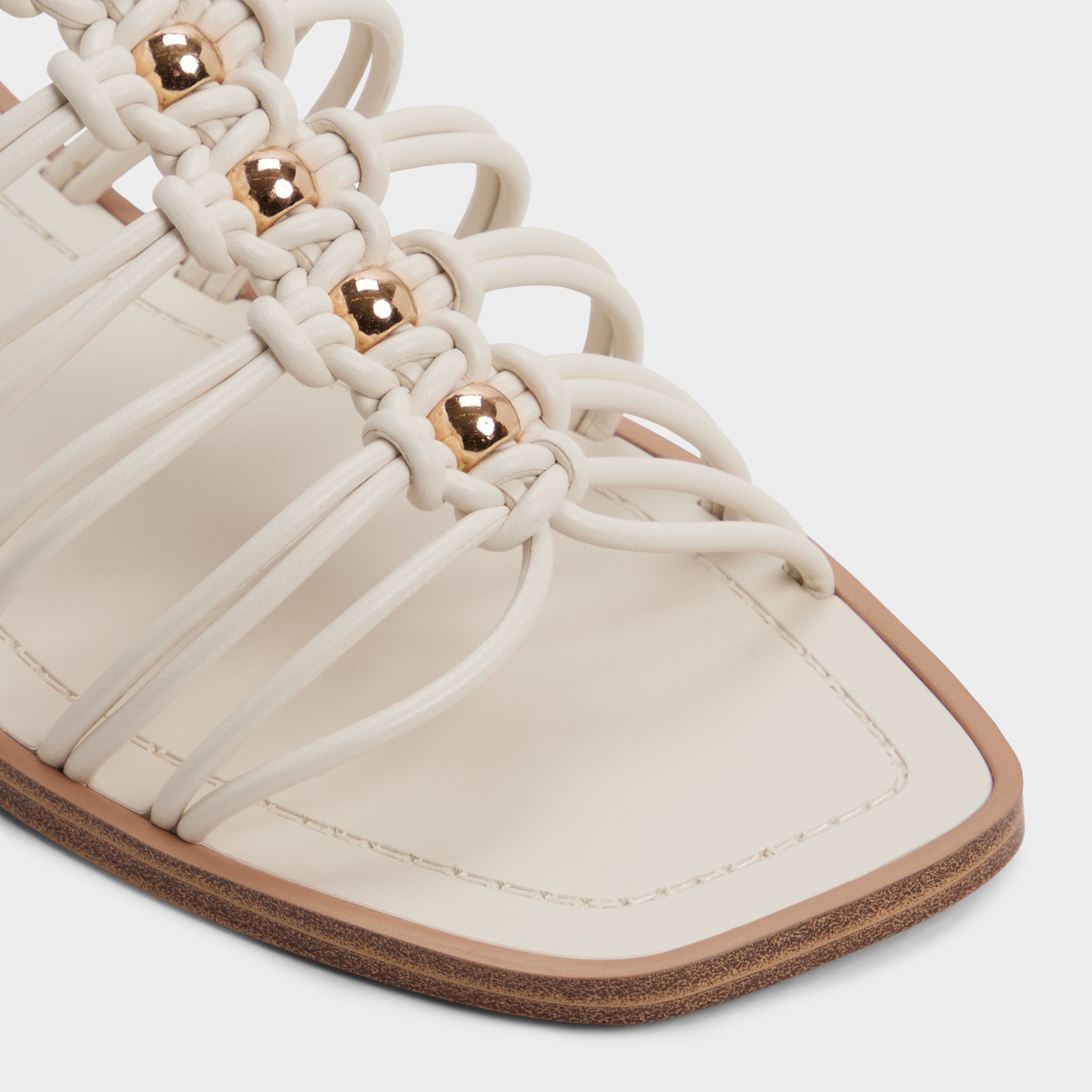 Unoma in White Bone - Strappy flat sandal | Aldo discount